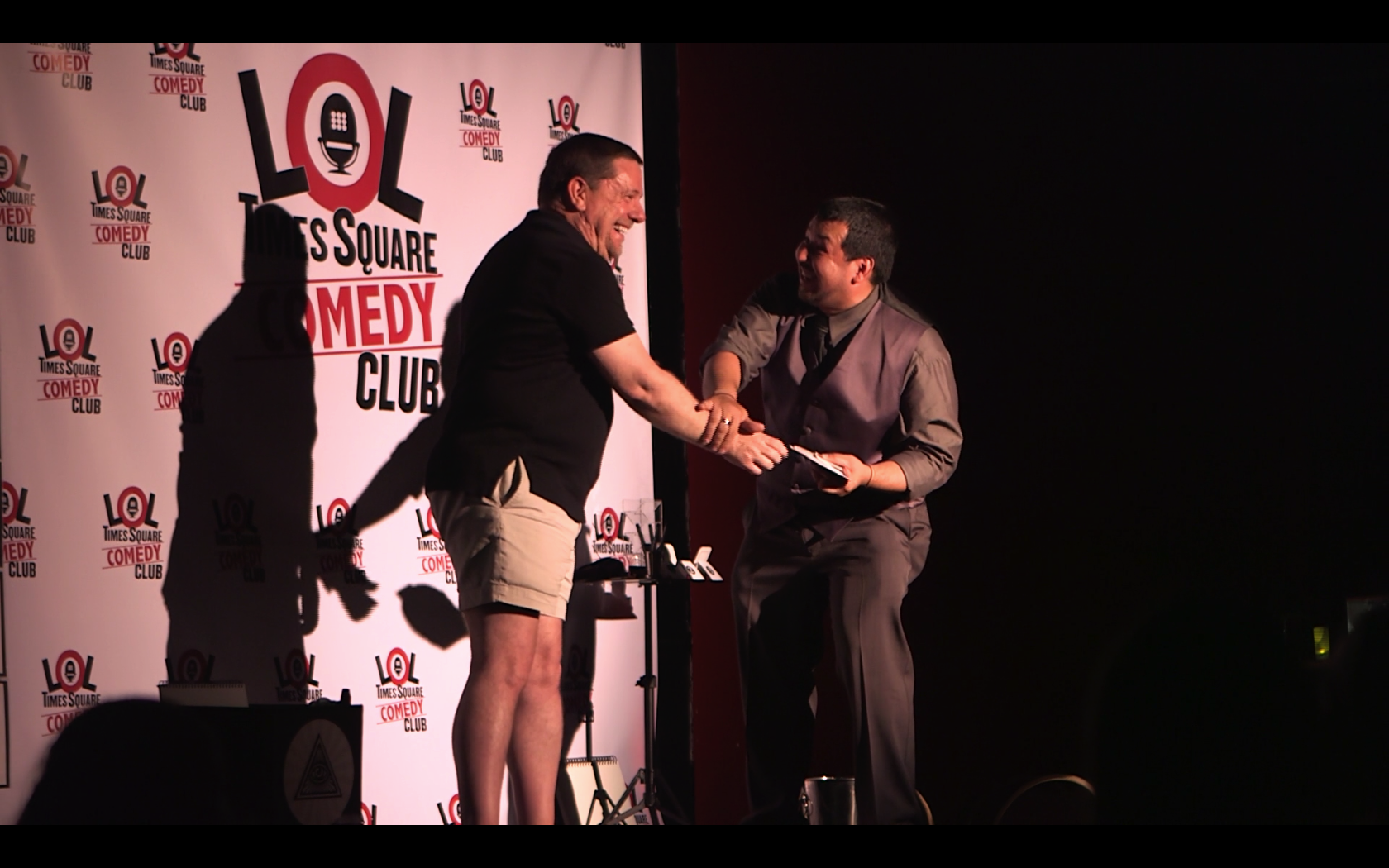 Lol Comedy Club Stage with Omar olusion performing a comedic card effect